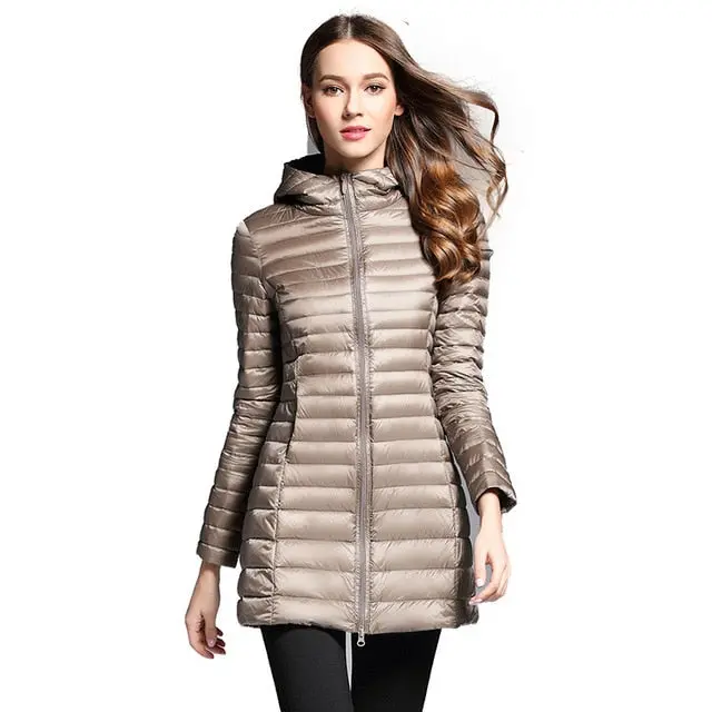 Stay warm and stylish this winter with our women's long down jacket—featuring ultra-lightweight construction, premium duck down insulation, a cozy quilted design, and a functional hood. - Image 4