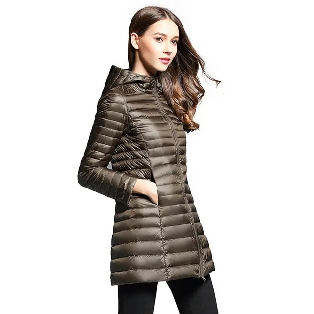 Stay warm and stylish this winter with our women's long down jacket—featuring ultra-lightweight construction, premium duck down insulation, a cozy quilted design, and a functional hood. - Image 8