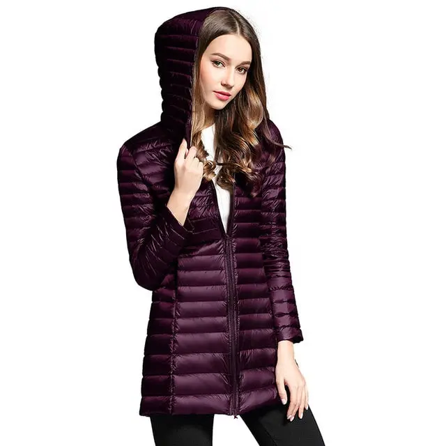 Stay warm and stylish this winter with our women's long down jacket—featuring ultra-lightweight construction, premium duck down insulation, a cozy quilted design, and a functional hood. - Image 3