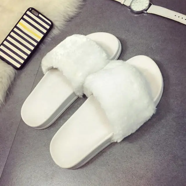 Stylish, cozy slip-on slippers for women featuring soft faux fur lining, flat comfortable soles, and a versatile casual design—perfect for lounging or everyday wear. - Image 3